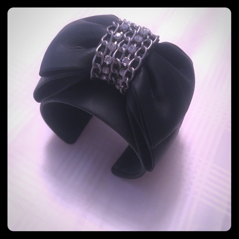 Black leather cuff with bow & rhinestone detailing